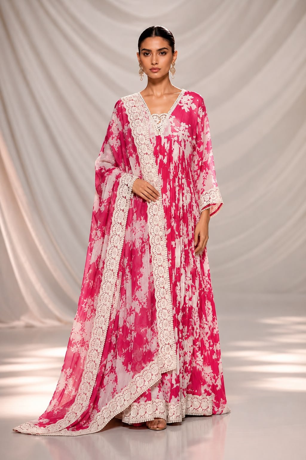 PINK FLORAL FRONT Elegant pink floral Anarkali gown with Chikankari lace neckline, flowing silhouette, three-quarter sleeves, and matching floral dupatta with lace borders
