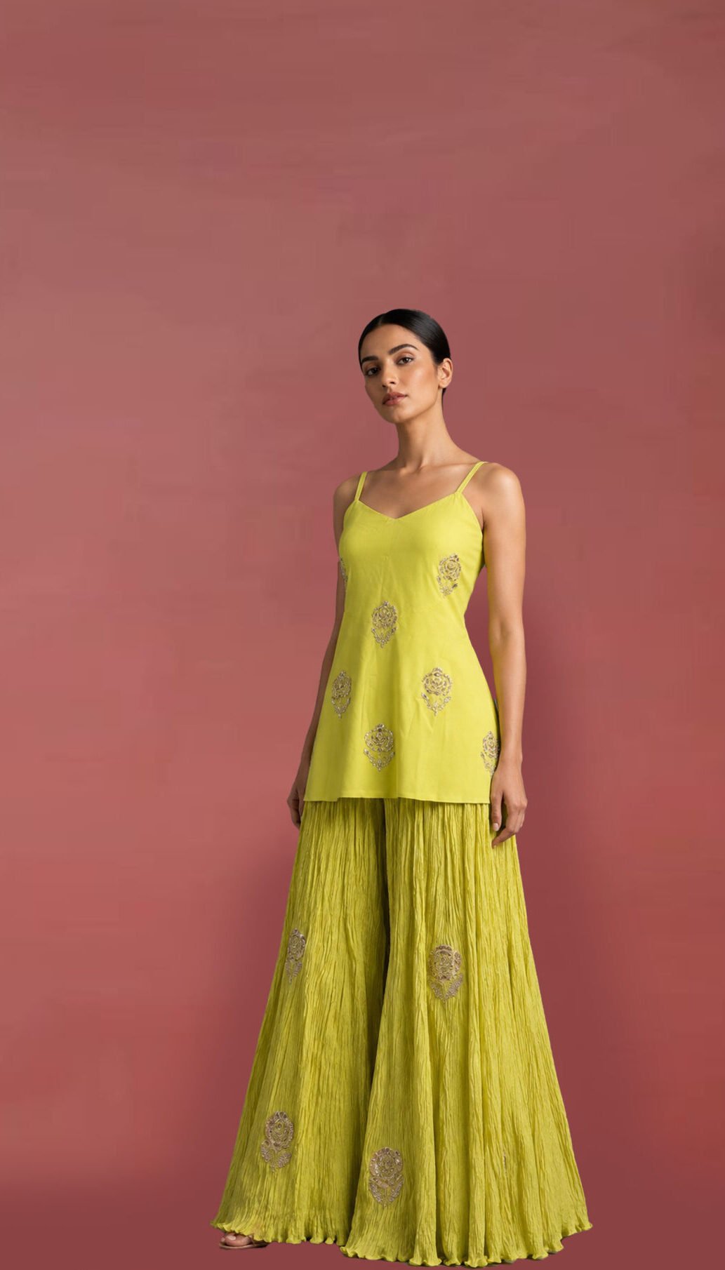 Luxury yellow embroidered Indo-Western co-ord set with embellished camisole top and crinkle sharara for festive and wedding wear