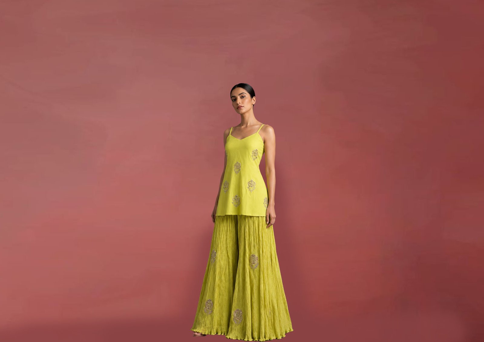 Luxury yellow embroidered Indo-Western co-ord set with embellished camisole top and crinkle sharara for festive and wedding wear