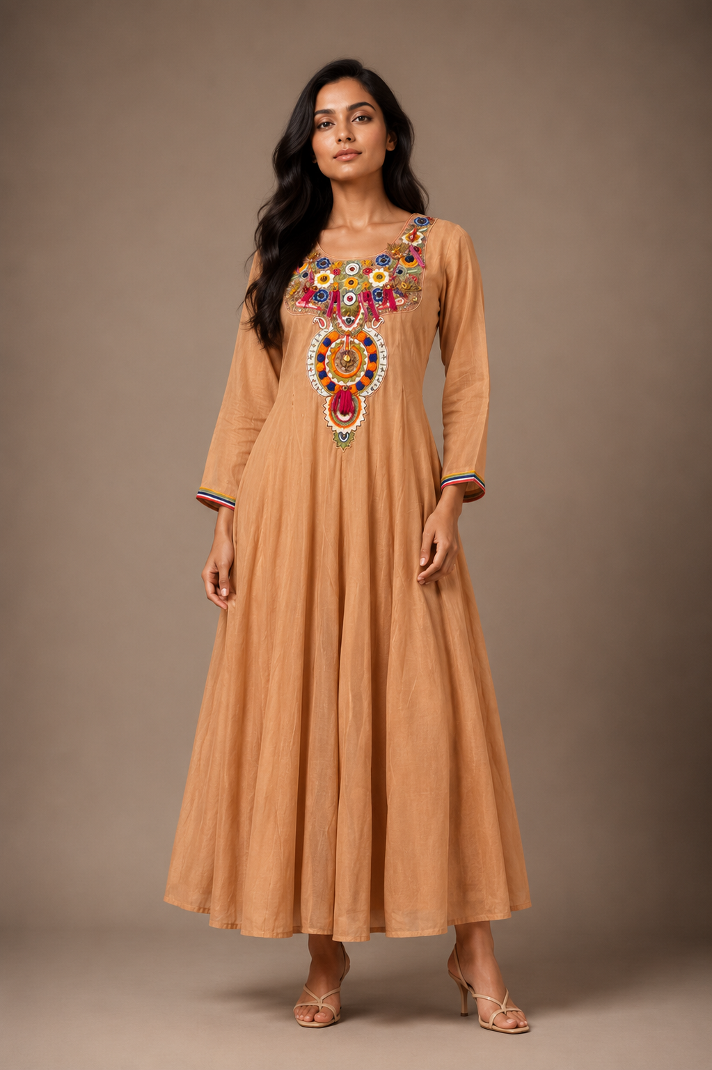 cream front Model wearing a sand beige embroidered kurta and straight pant set with a matching chanderi dupatta featuring scalloped borders on all four sides in a luxury studio setting.