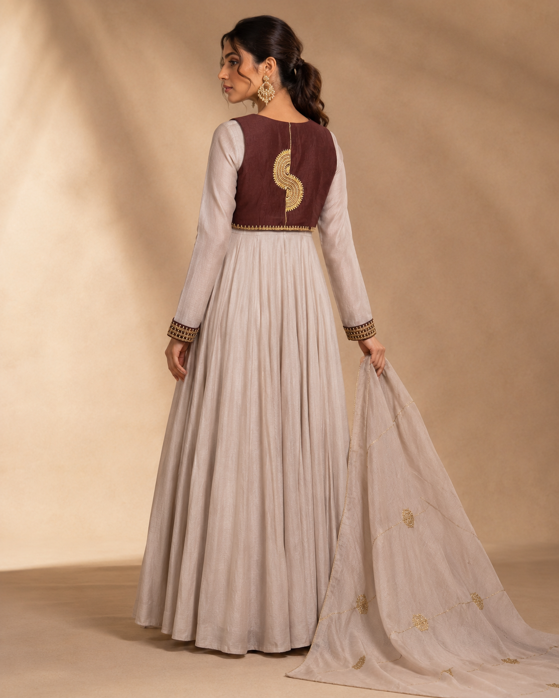 Brown back Noor-e-Chand Ensemble - A luxury ivory chanderi Anarkali with hand-embroidered brown sleeveless jacket and self-coloured dupatta featuring diagonal Chand Baali embroidery.