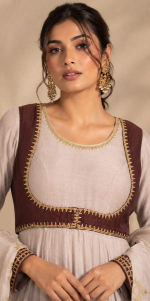 Noor-e-Chand Ensemble - A luxury ivory chanderi Anarkali with hand-embroidered brown sleeveless jacket and self-coloured dupatta featuring diagonal Chand Baali embroidery.