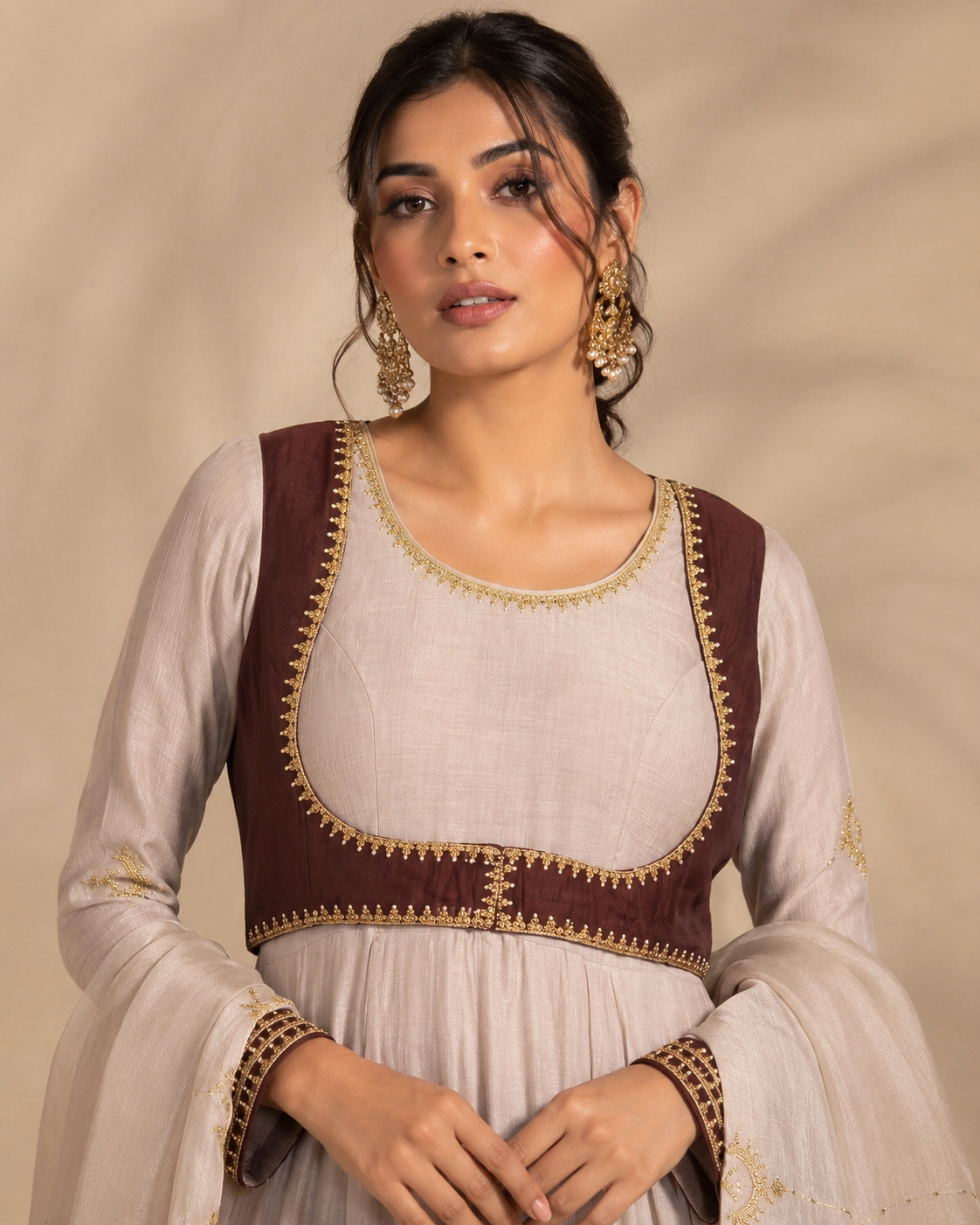 Brown jacket closeup Noor-e-Chand Ensemble - A luxury ivory chanderi Anarkali with hand-embroidered brown sleeveless jacket and self-coloured dupatta featuring diagonal Chand Baali embroidery.